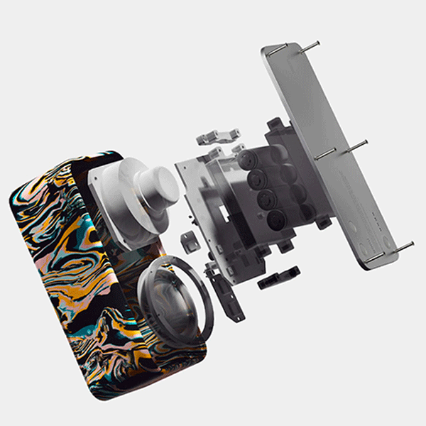 Bluetooth Speaker with marble design and disassembled electronics on a light grey background