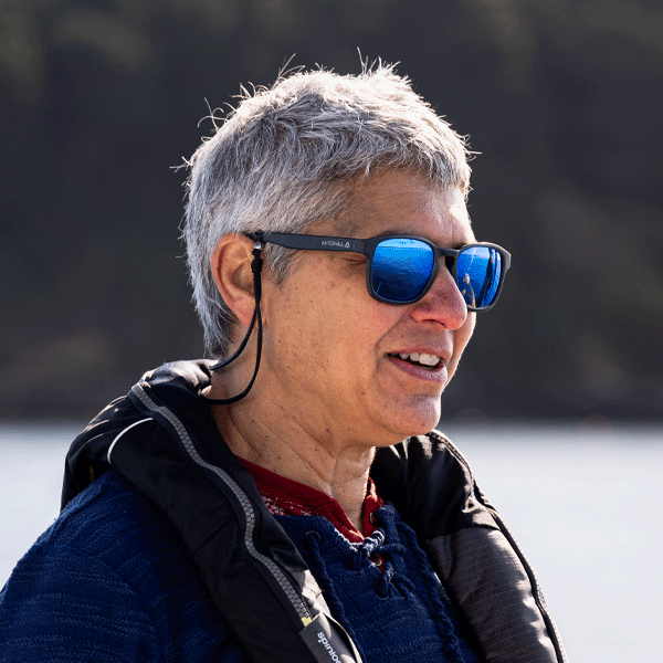 Woman wearing sunglasses with a blurred natural background