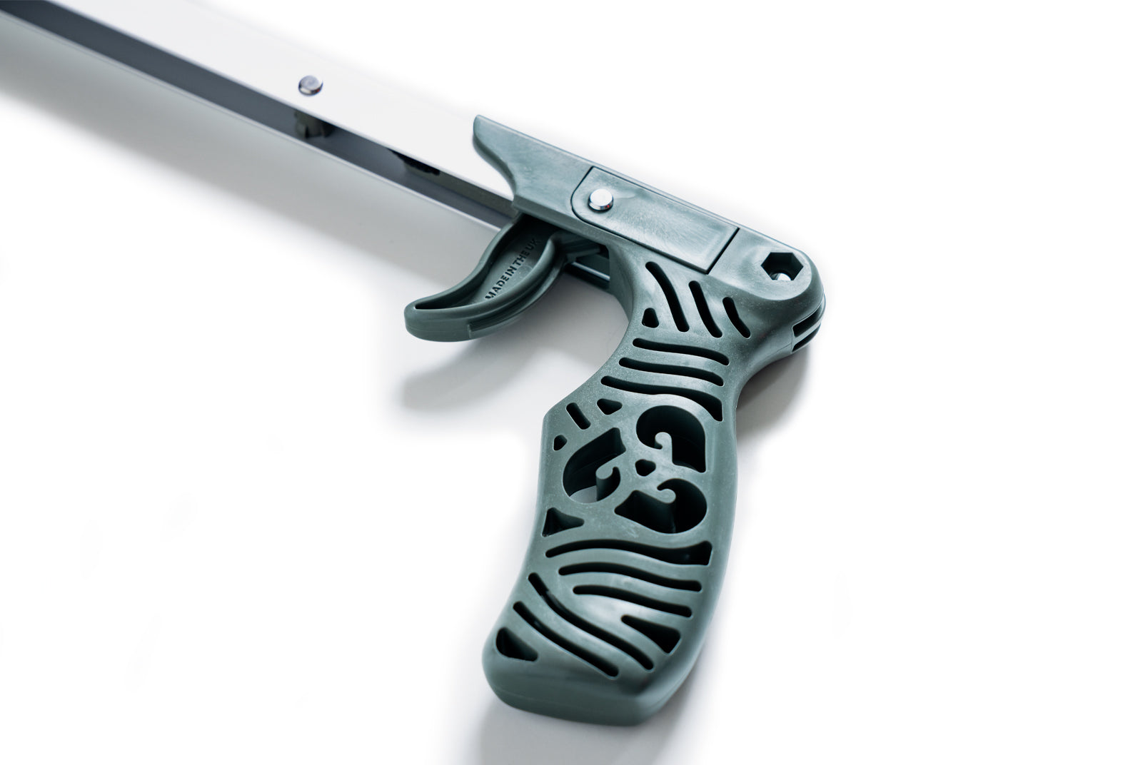 Close up of the green recycled ocean plastic handle for this children's litter picker.