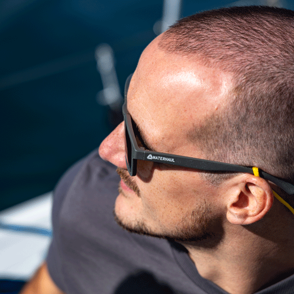 Man wearing sunglasses with a blurred background