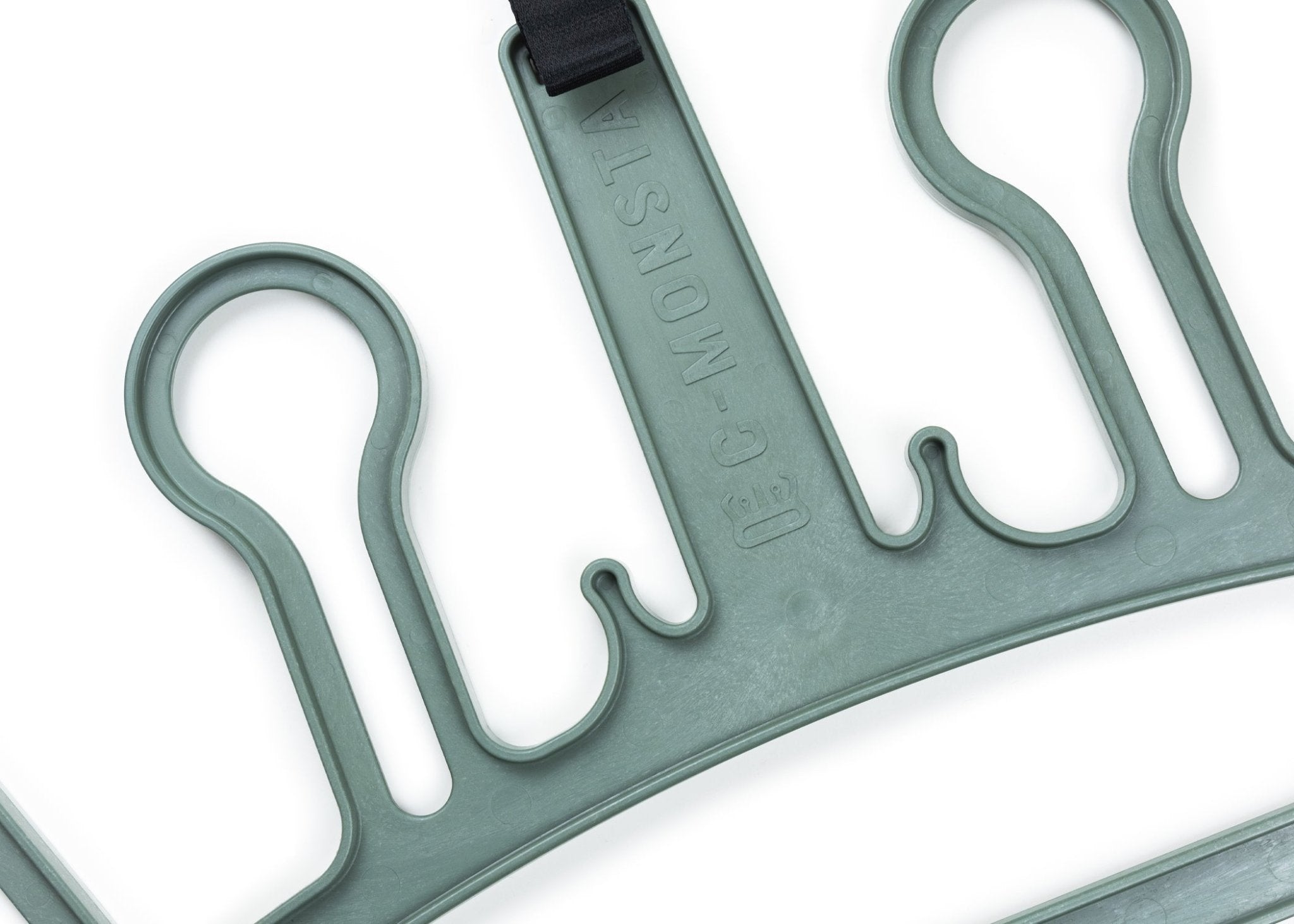 Sturdy wetsuit hanger crafted from reclaimed ocean plastic, perfect for surfers and divers.